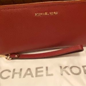 Michael Kors zip around leather Continental wristlet in deep red gently used